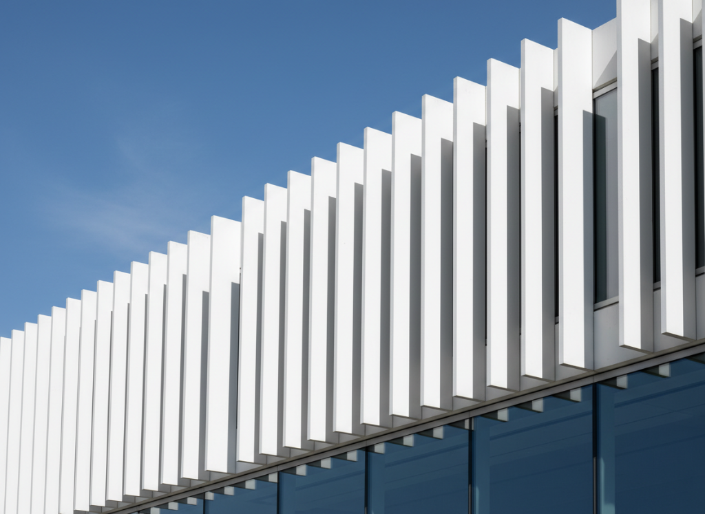 Close-up of UHPC vertical fins used in contemporary façade design.